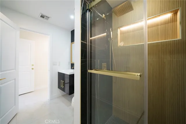 a bathroom with a shower and a toilet