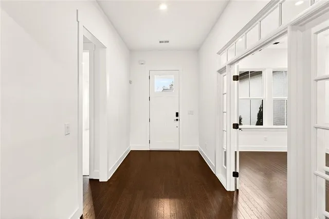 a kitchen with stainless steel appliances a stove top oven a sink and a refrigerator