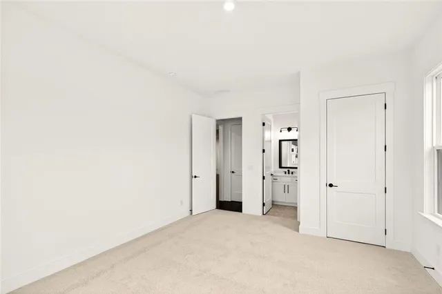 a bathroom with a shower and a mirror