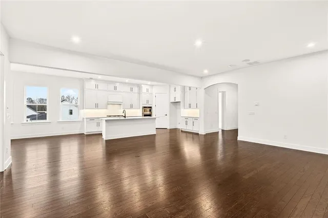 a view of a balcony with a floor to ceiling window and city view