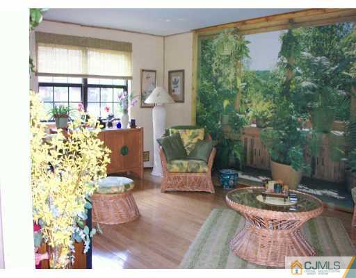 6508 Hana Road Edison, NJ 08817 - Photo 2 of 8 a living room with furniture and a large window