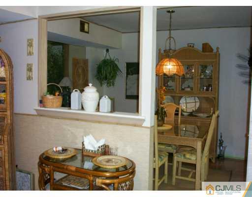 6508 Hana Road Edison, NJ 08817 - Photo 4 of 8 a bathroom with a sink and mirror