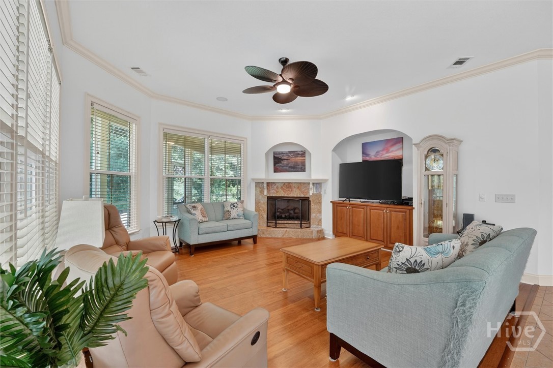 94 Rookery View Drive Midway, GA 31320 - Photo 12 of 46 Spacious family room with gas fireplace and built-in media cabinet