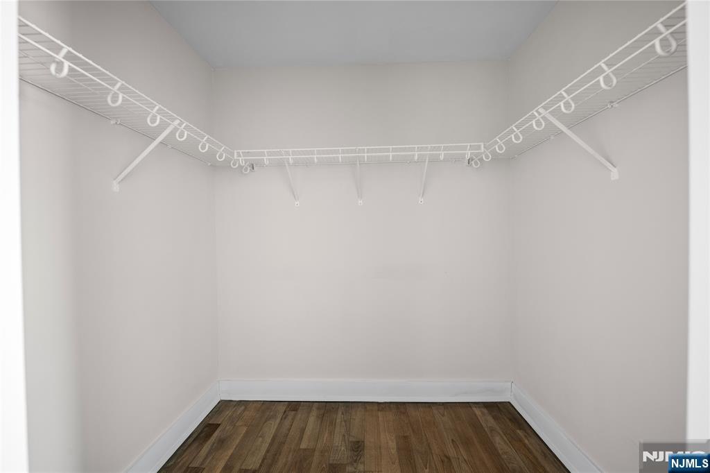6404 City Place Edgewater, NJ 07020 - Photo 11 of 22 a view of walk in closet with empty racks