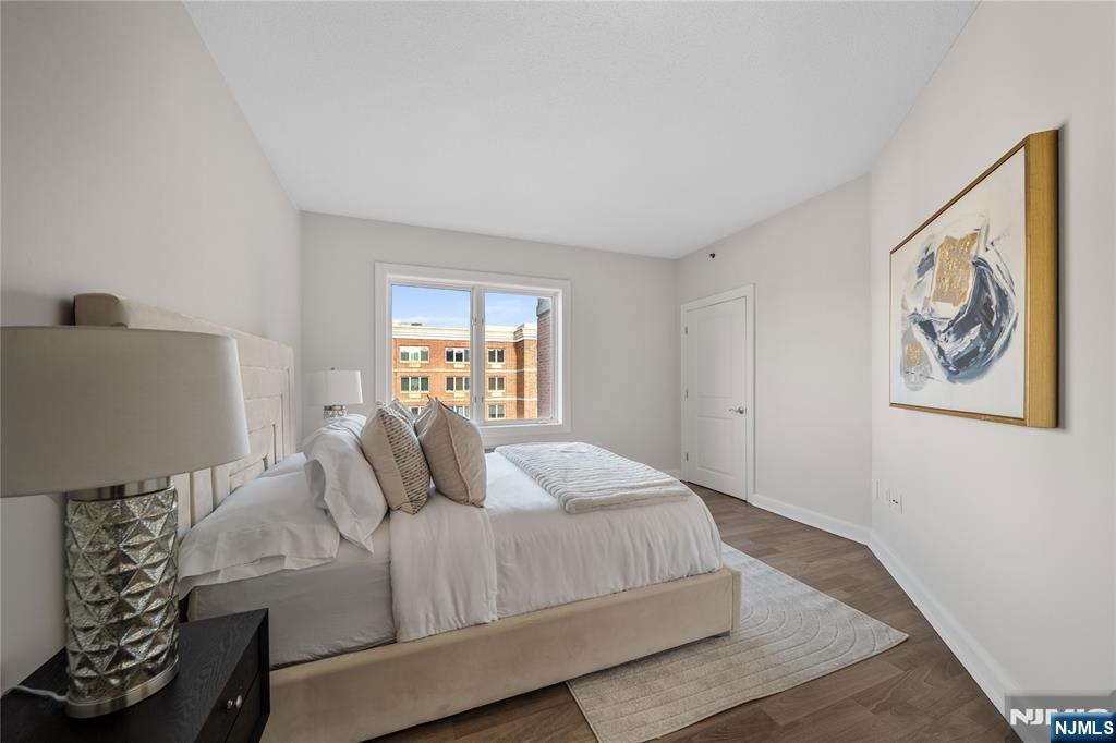 6404 City Place Edgewater, NJ 07020 - Photo 15 of 22 a bedroom with a bed and a window