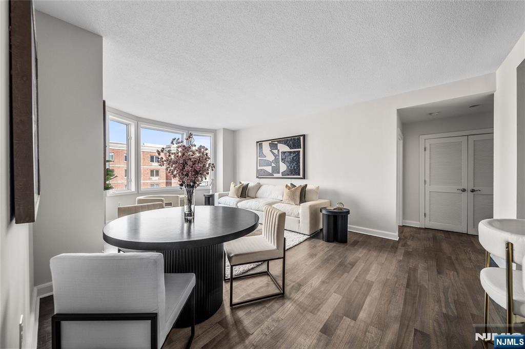6404 City Place Edgewater, NJ 07020 - Photo 5 of 22 a dining room with furniture and wooden floor
