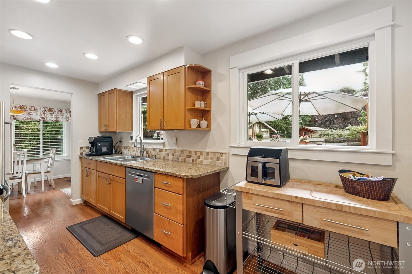 20623 98th Place South Kent, WA 98031 - Photo 12 of 37 a kitchen with stainless steel appliances granite countertop a stove a sink and a refrigerator