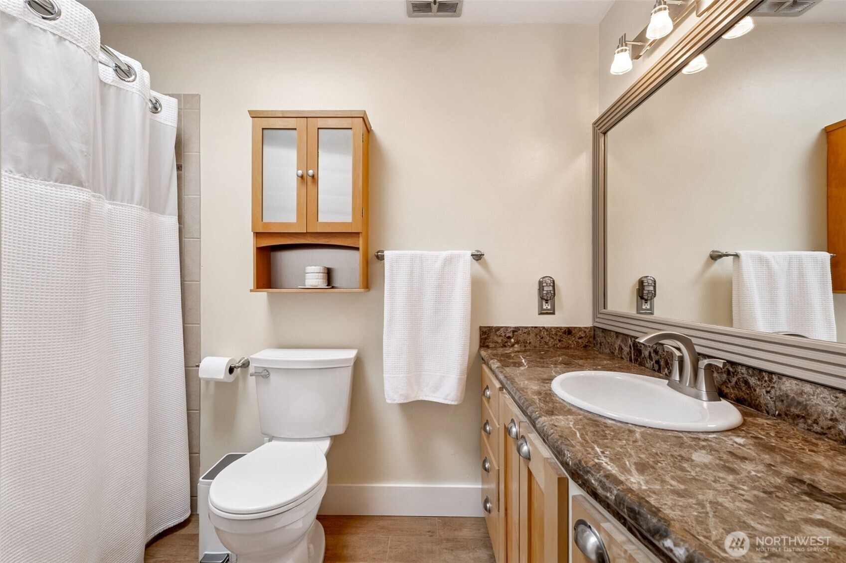 20623 98th Place South Kent, WA 98031 - Photo 16 of 37 a bathroom with a granite countertop sink toilet and mirror