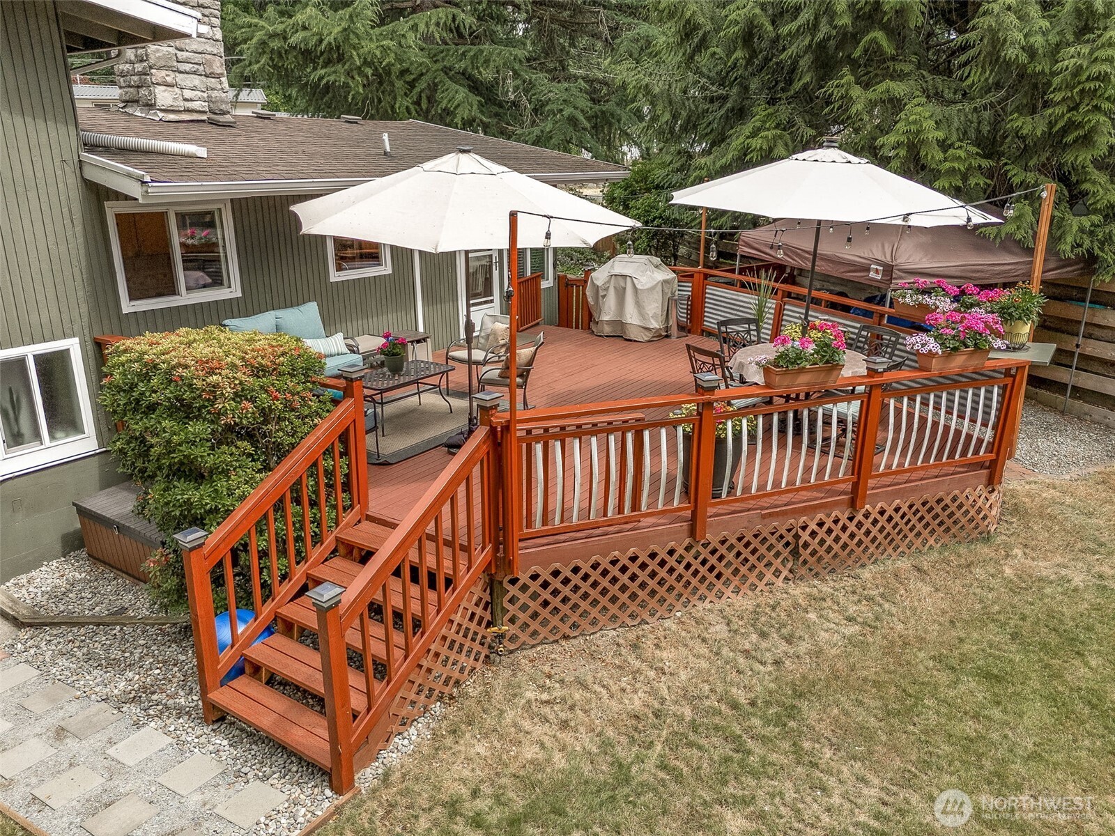 20623 98th Place South Kent, WA 98031 - Photo 24 of 37 a view of a house with wooden deck and furniture