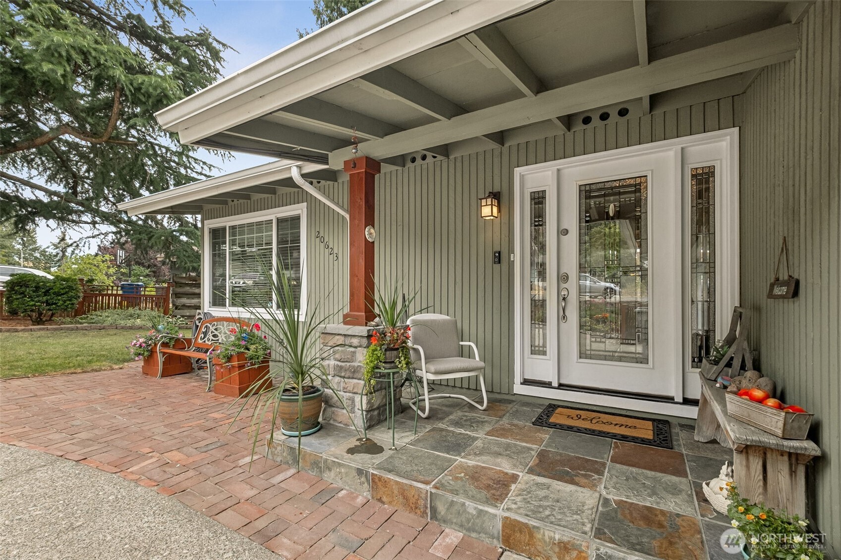20623 98th Place South Kent, WA 98031 - Photo 4 of 37 a view of a patio with table and chairs and potted plants