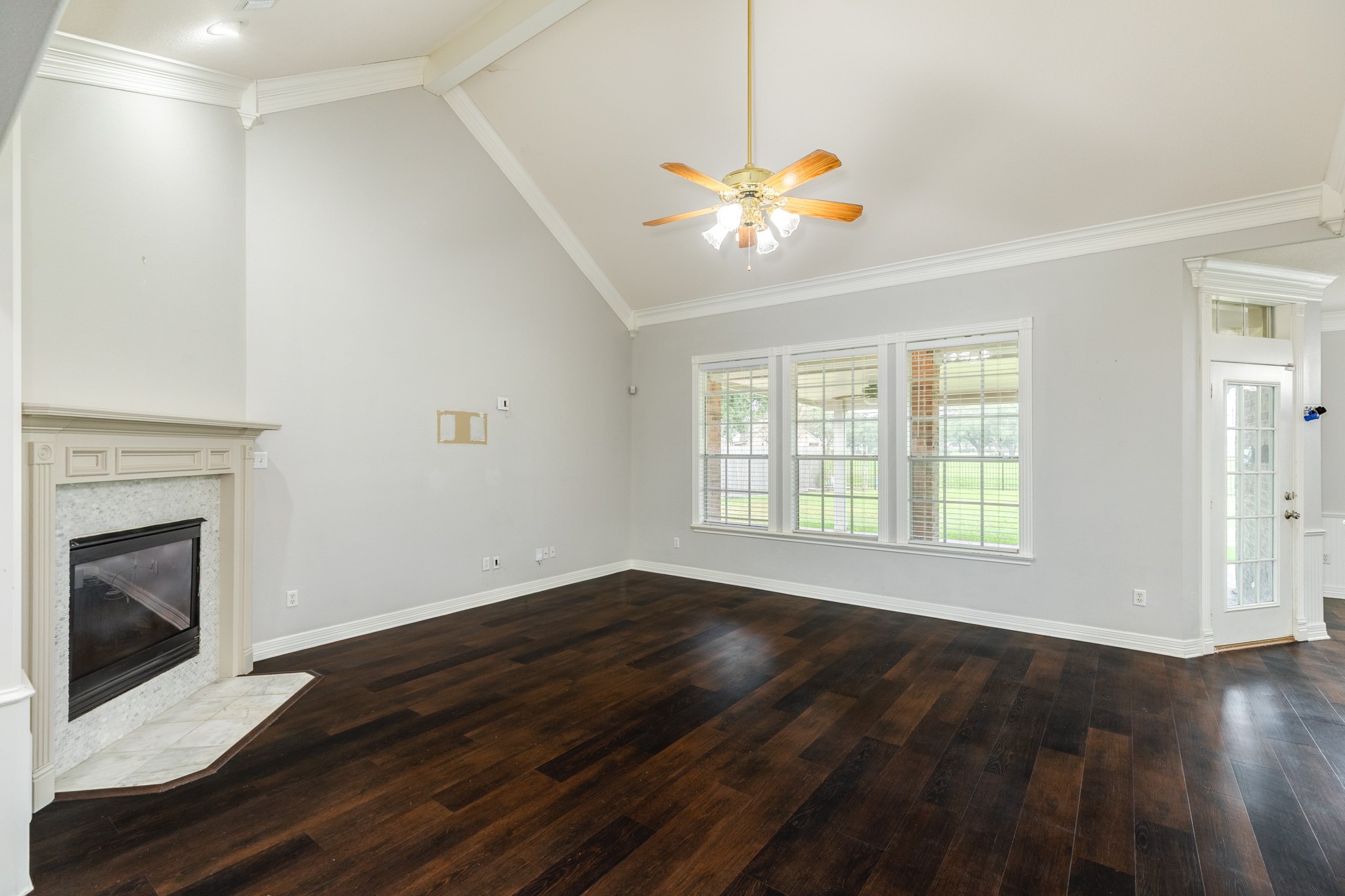 900 Enchanted Oaks Drive Angleton, TX 77515 - Photo 11 of 36 a view of an empty room with window and wooden floor