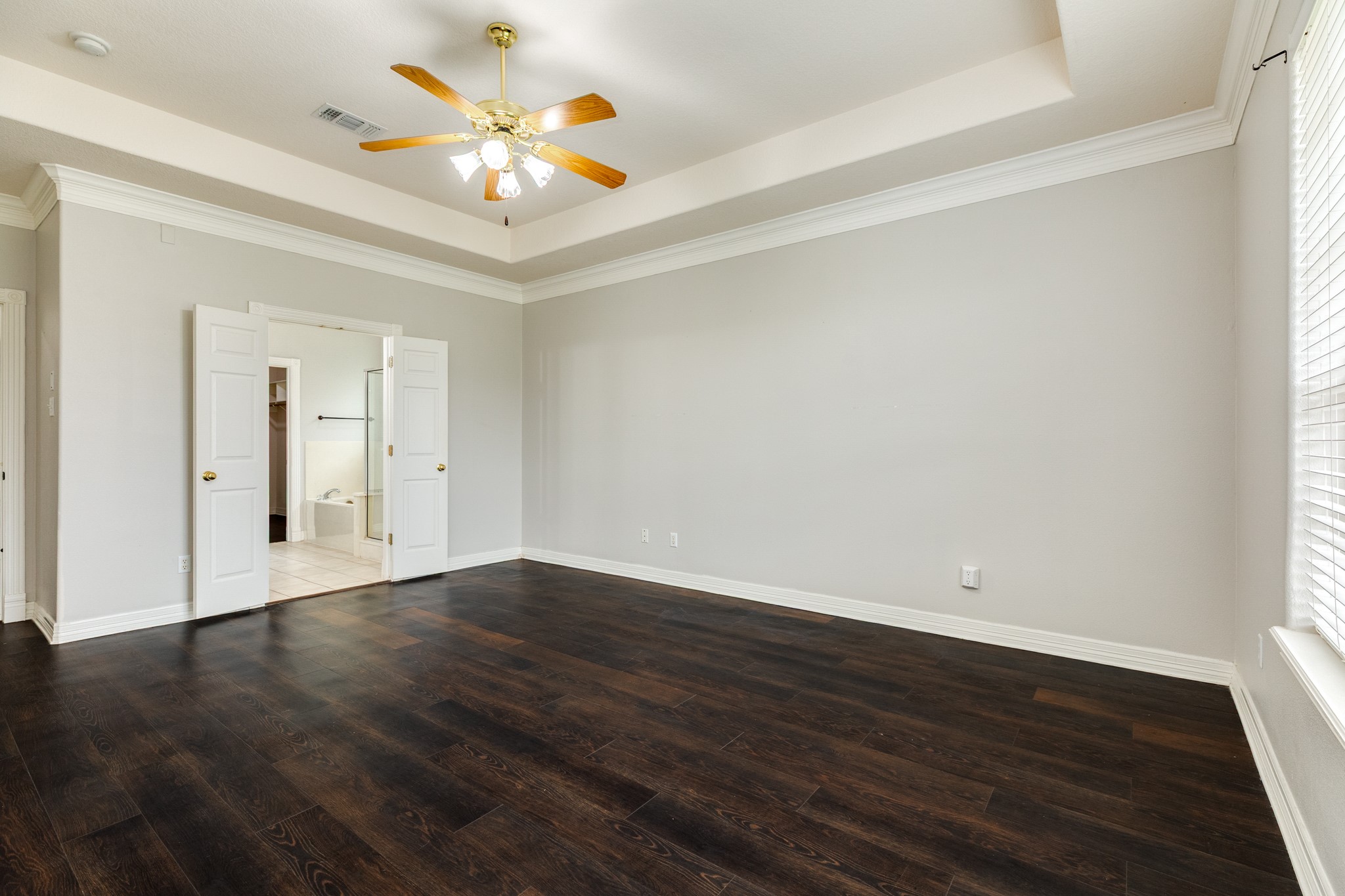 900 Enchanted Oaks Drive Angleton, TX 77515 - Photo 19 of 36 a view of an empty room with wooden floor