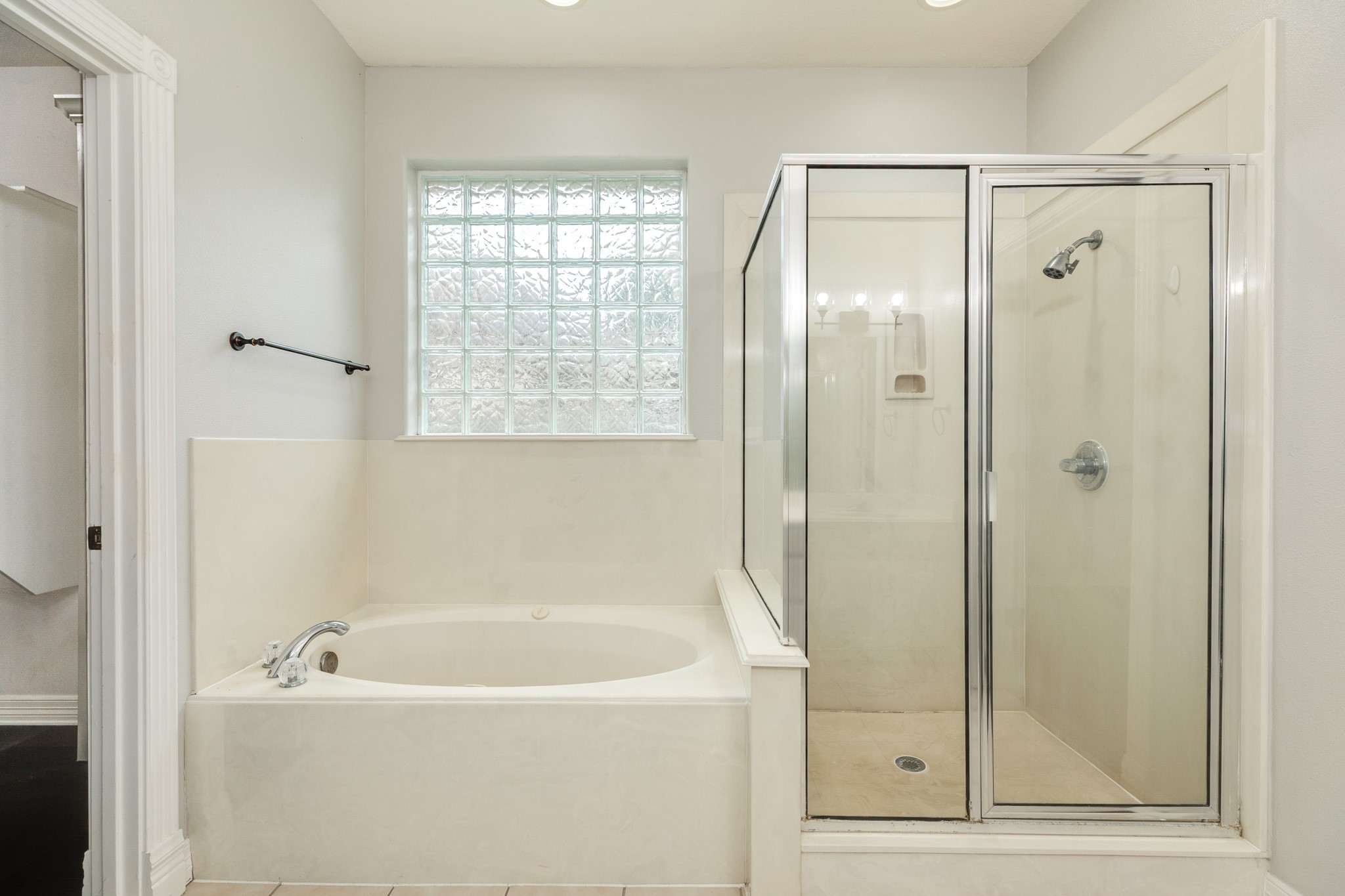 900 Enchanted Oaks Drive Angleton, TX 77515 - Photo 21 of 36 a white bath tub sitting next to a shower