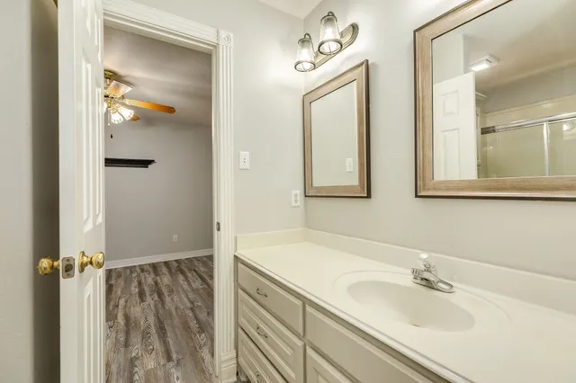 a bathroom with a sink and mirror