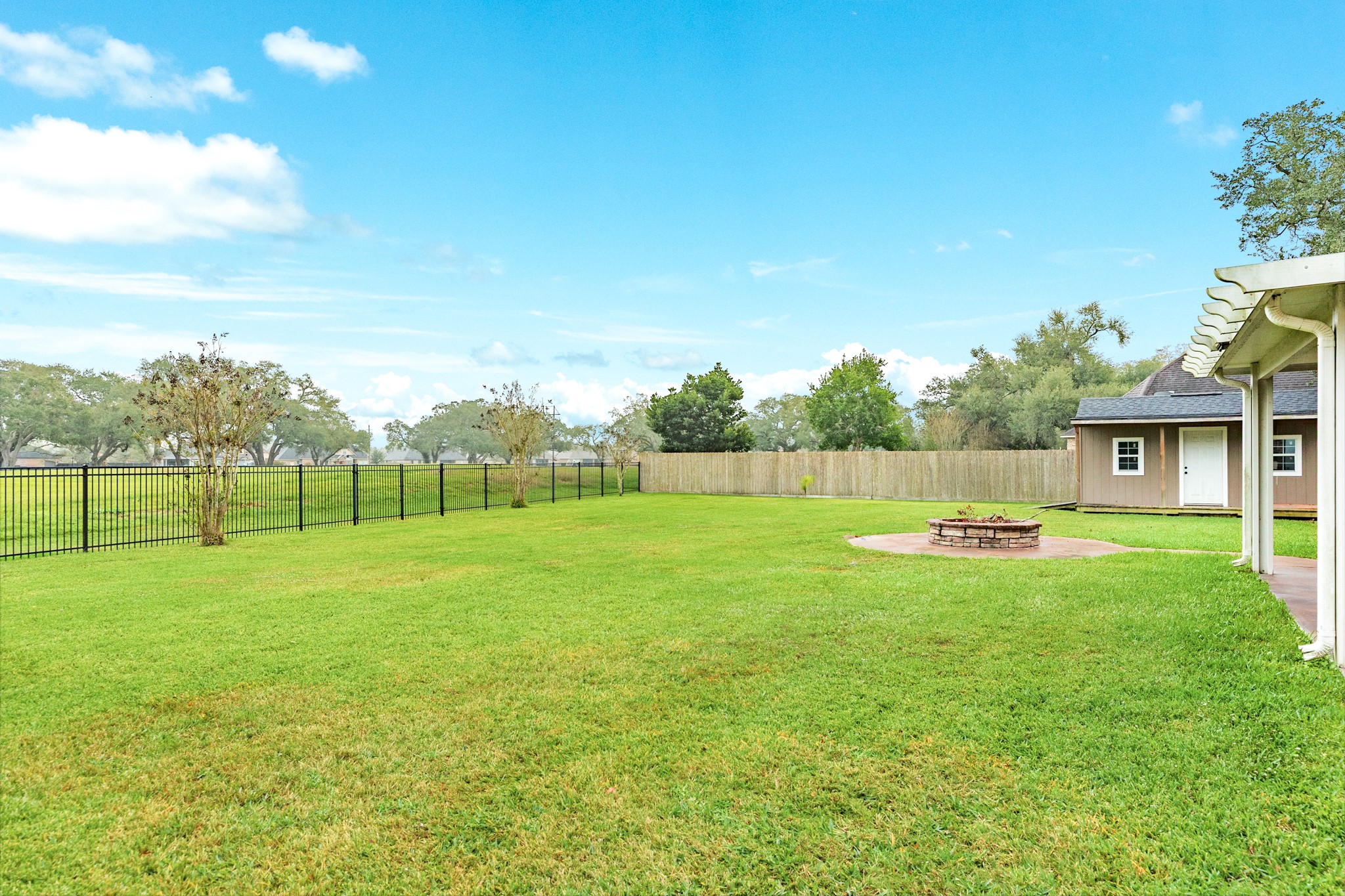 900 Enchanted Oaks Drive Angleton, TX 77515 - Photo 34 of 36 a view of a backyard with swimming pool