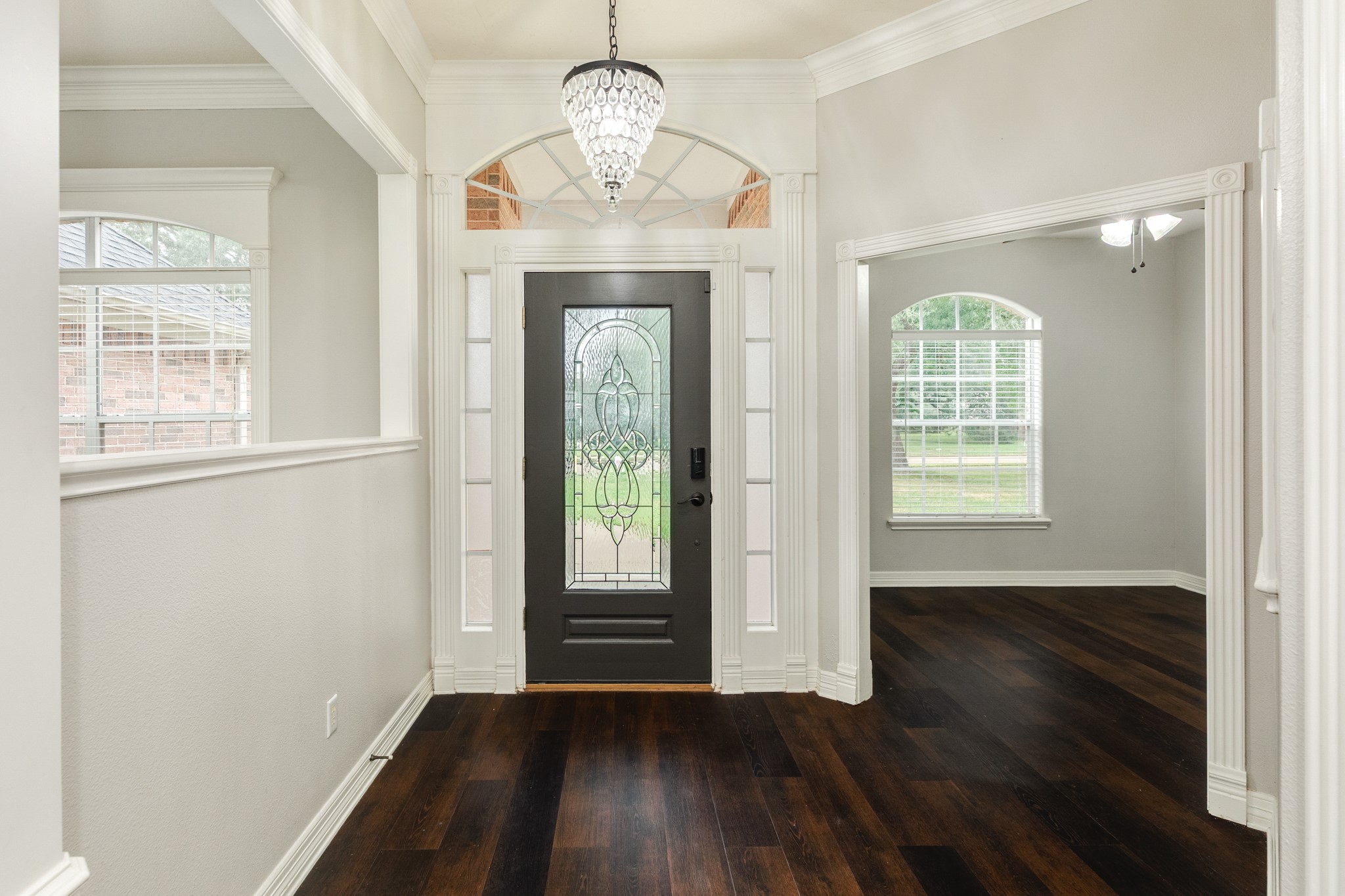 900 Enchanted Oaks Drive Angleton, TX 77515 - Photo 5 of 36 wooden floor in an empty room with a window