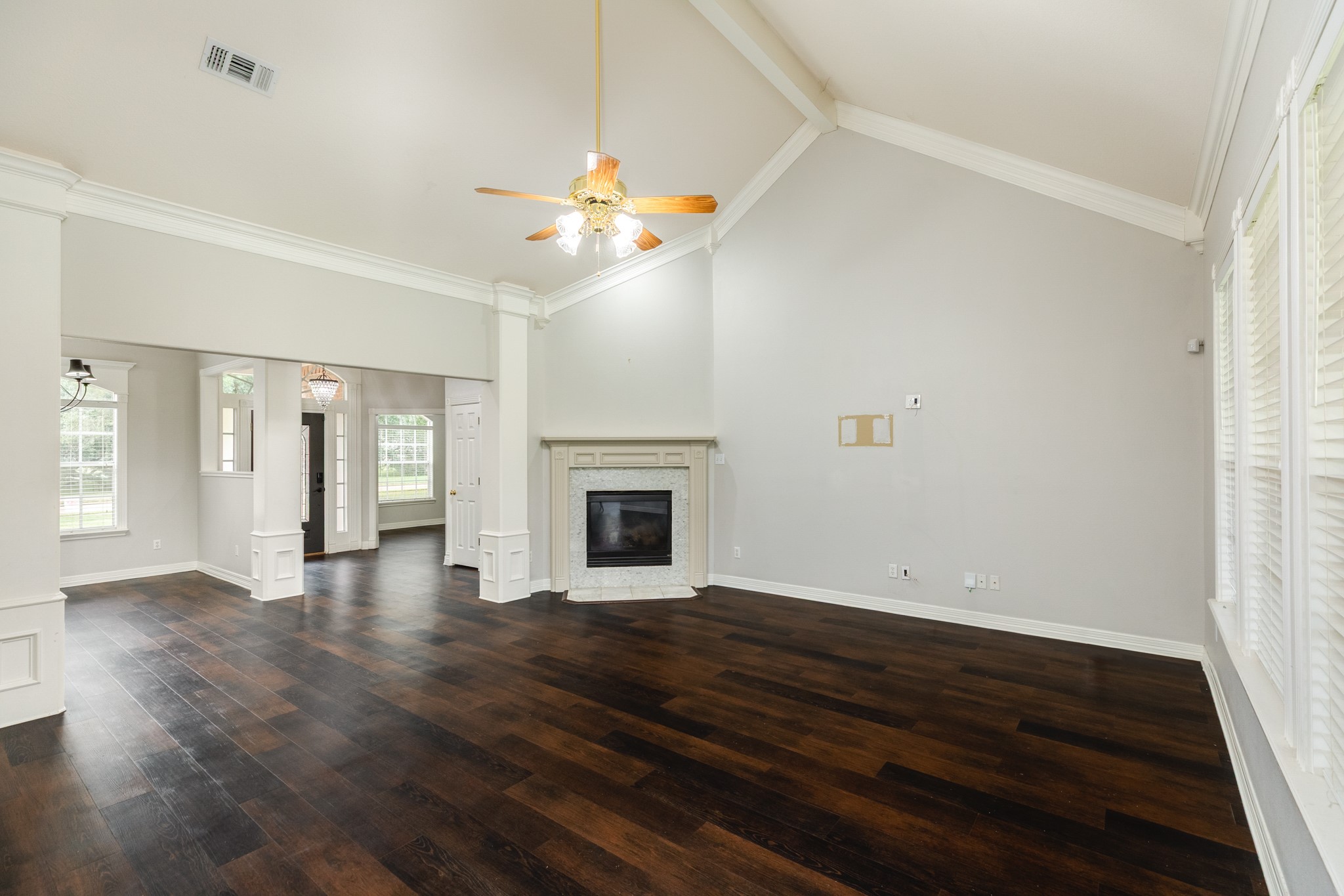 900 Enchanted Oaks Drive Angleton, TX 77515 - Photo 10 of 36 wooden floor in an empty room with a window
