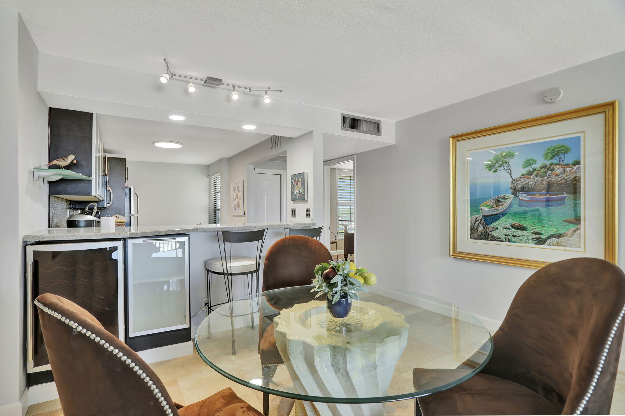 4 Royal Palm Way, Unit 6020 Boca Raton, FL 33432 - Photo 11 of 41 a view of a dining room with furniture and wooden floor