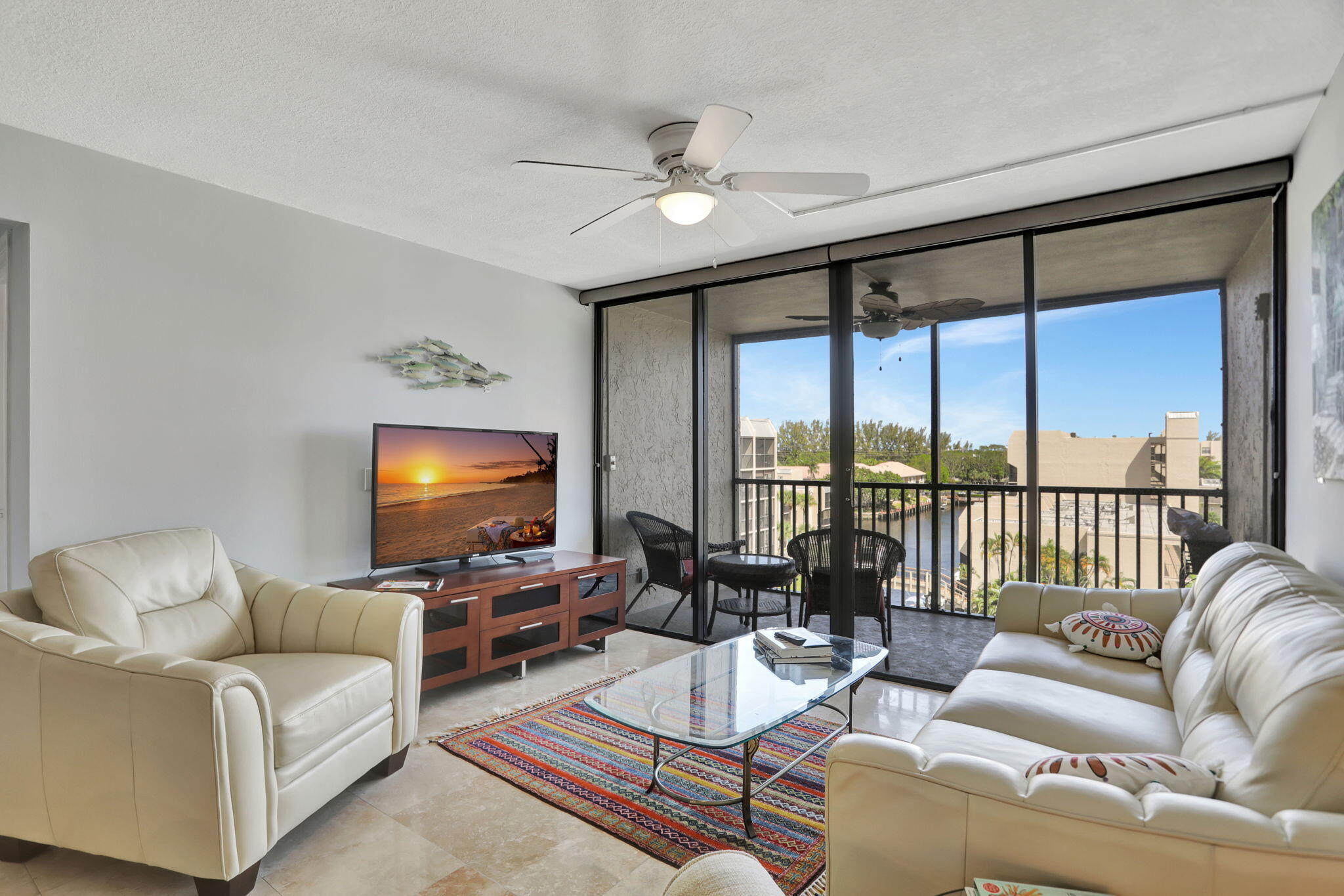 4 Royal Palm Way, Unit 6020 Boca Raton, FL 33432 - Photo 14 of 41 a living room with furniture and a flat screen tv