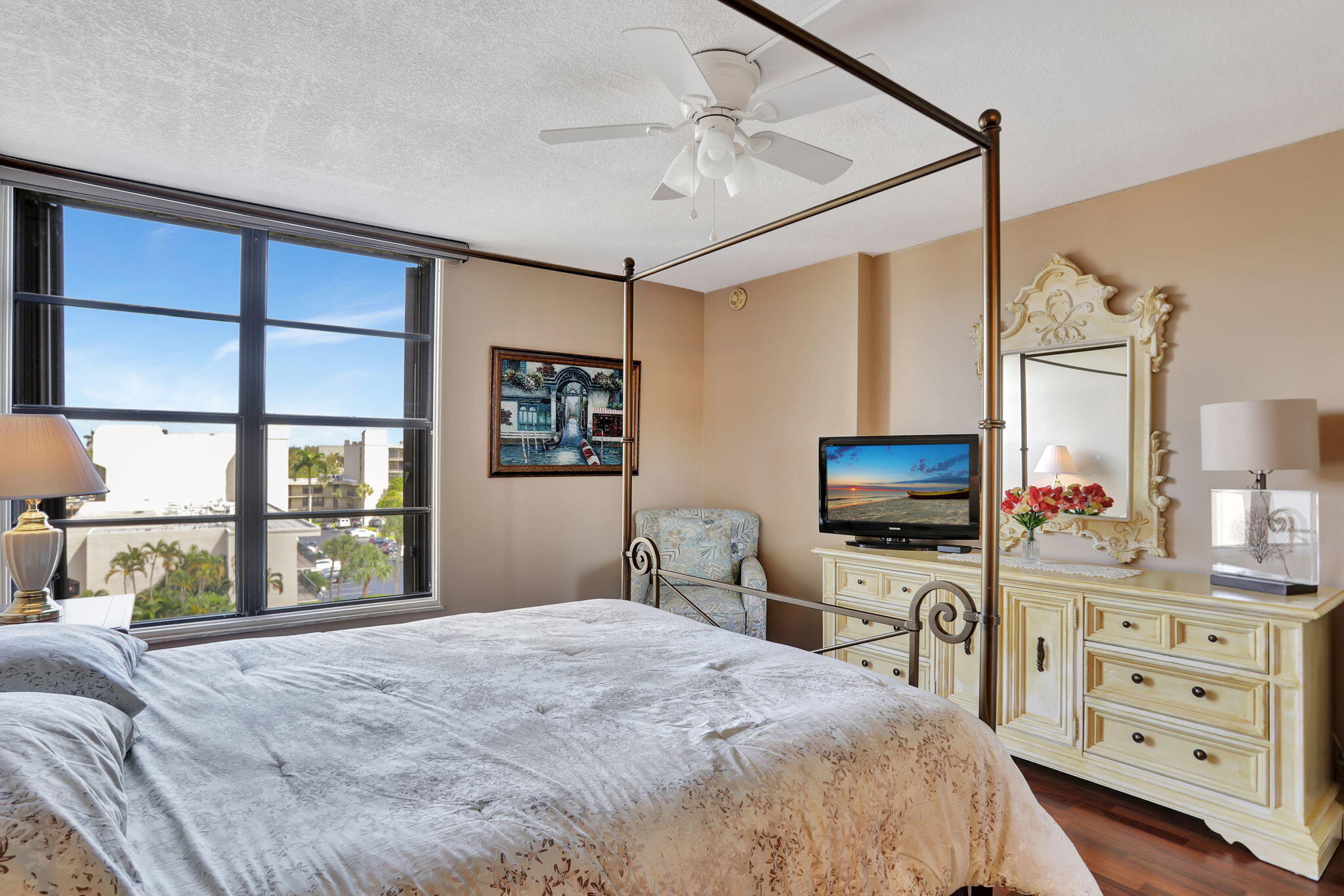 4 Royal Palm Way, Unit 6020 Boca Raton, FL 33432 - Photo 17 of 41 a bedroom with a bed a flat tv screen and a dresser in it