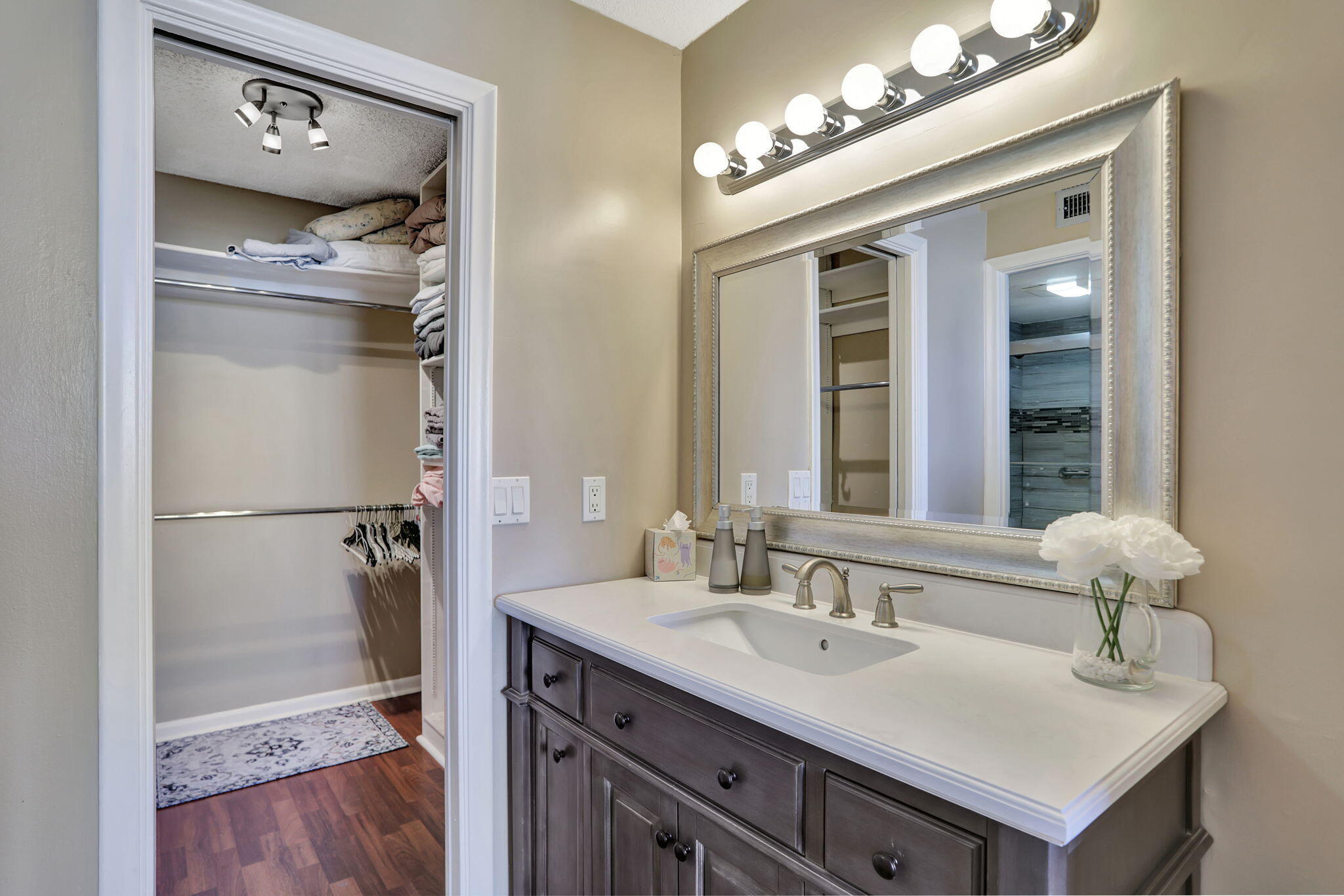 4 Royal Palm Way, Unit 6020 Boca Raton, FL 33432 - Photo 19 of 41 a bathroom with a sink vanity and a mirror