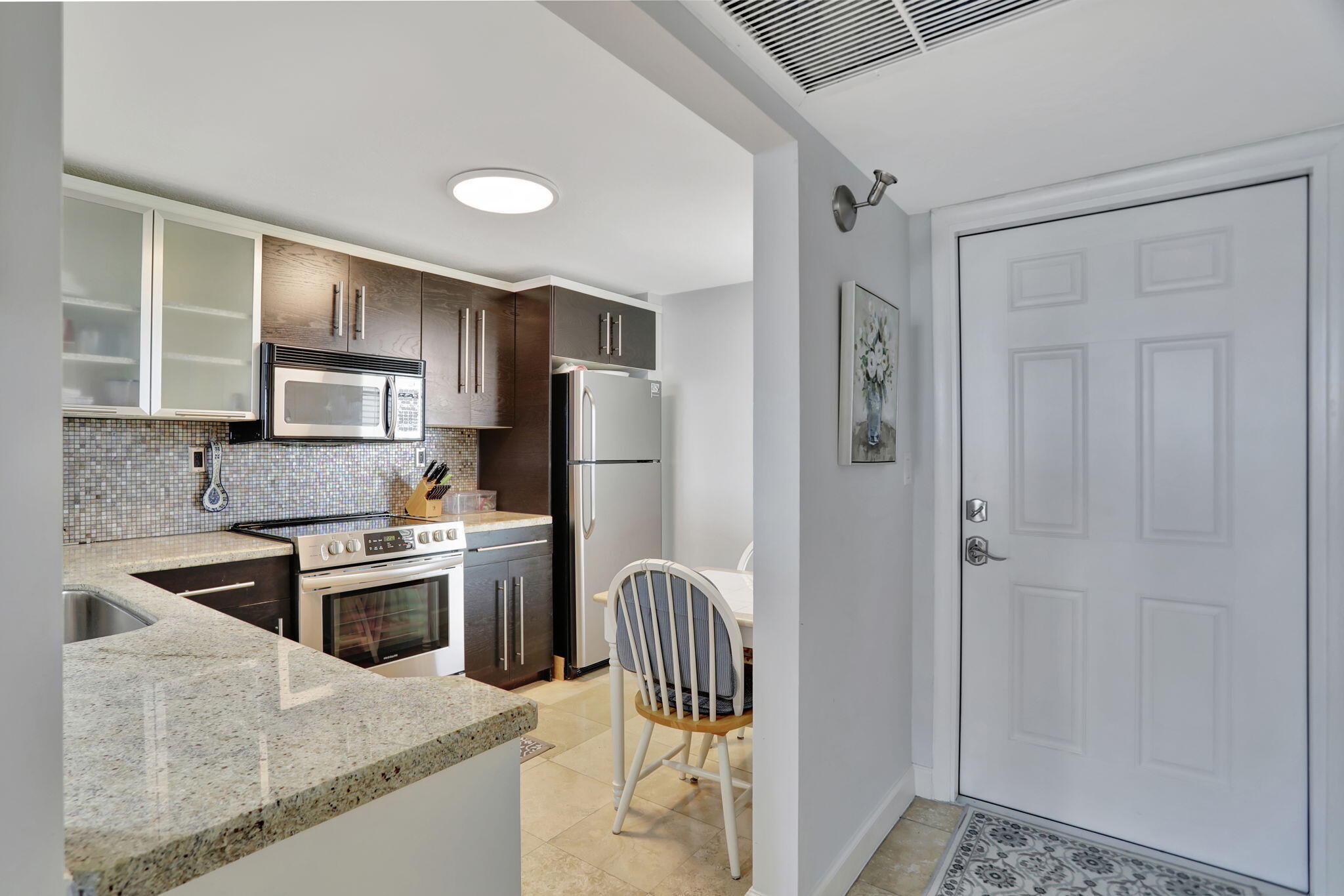 4 Royal Palm Way, Unit 6020 Boca Raton, FL 33432 - Photo 3 of 41 a kitchen with stainless steel appliances granite countertop a refrigerator and a stove top oven