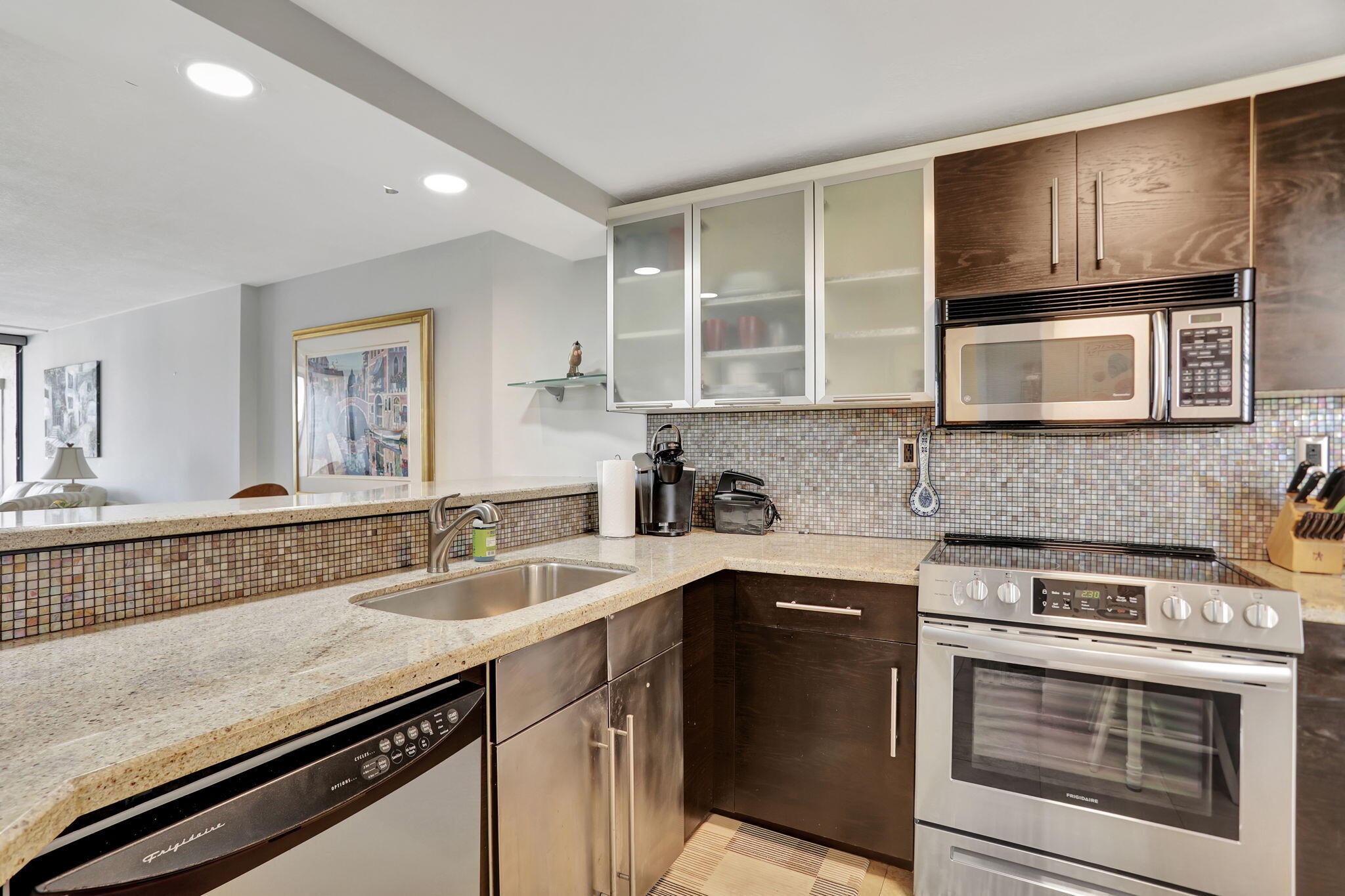 4 Royal Palm Way, Unit 6020 Boca Raton, FL 33432 - Photo 5 of 41 a kitchen with stainless steel appliances granite countertop a sink stove and microwave