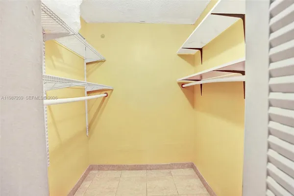 a view of walk in closet with window