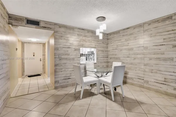 a view of a hallway with seating area