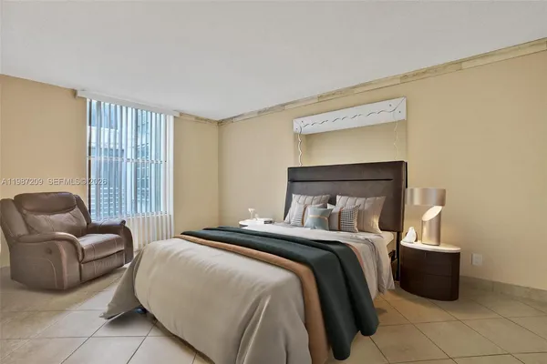 a bedroom with a bed and a couch