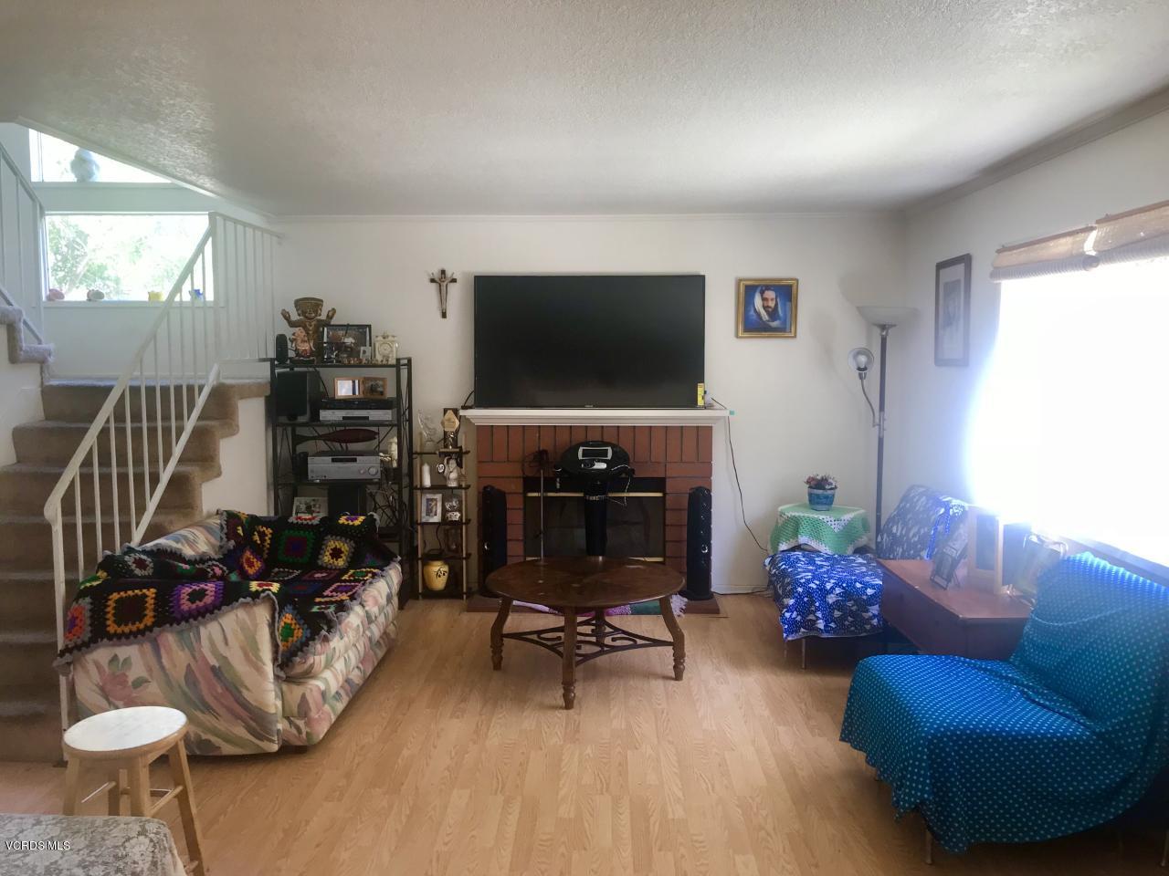 500 Percy Street, Unit 54 Oxnard, CA 93033 - Photo 2 of 9 a living room with furniture and a flat screen tv
