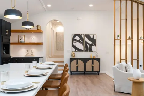 a large kitchen with a large counter top appliances and cabinets