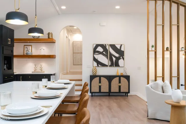 a large kitchen with a large counter top appliances and cabinets