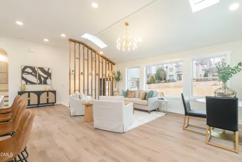 a room with kitchen island and a large window