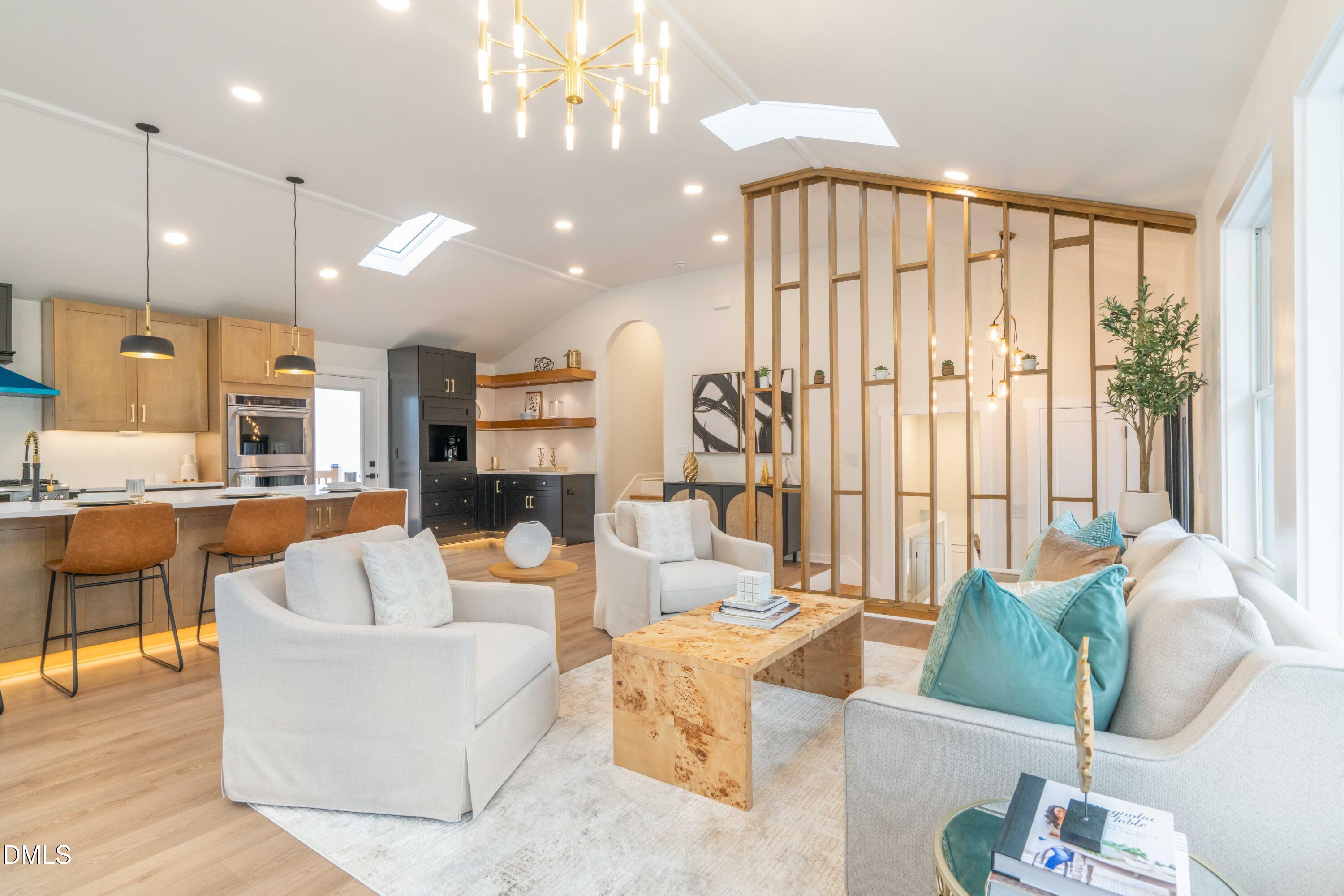 721 Currituck Drive Raleigh, NC 27609 - Photo 22 of 81 a living room with furniture and a large window