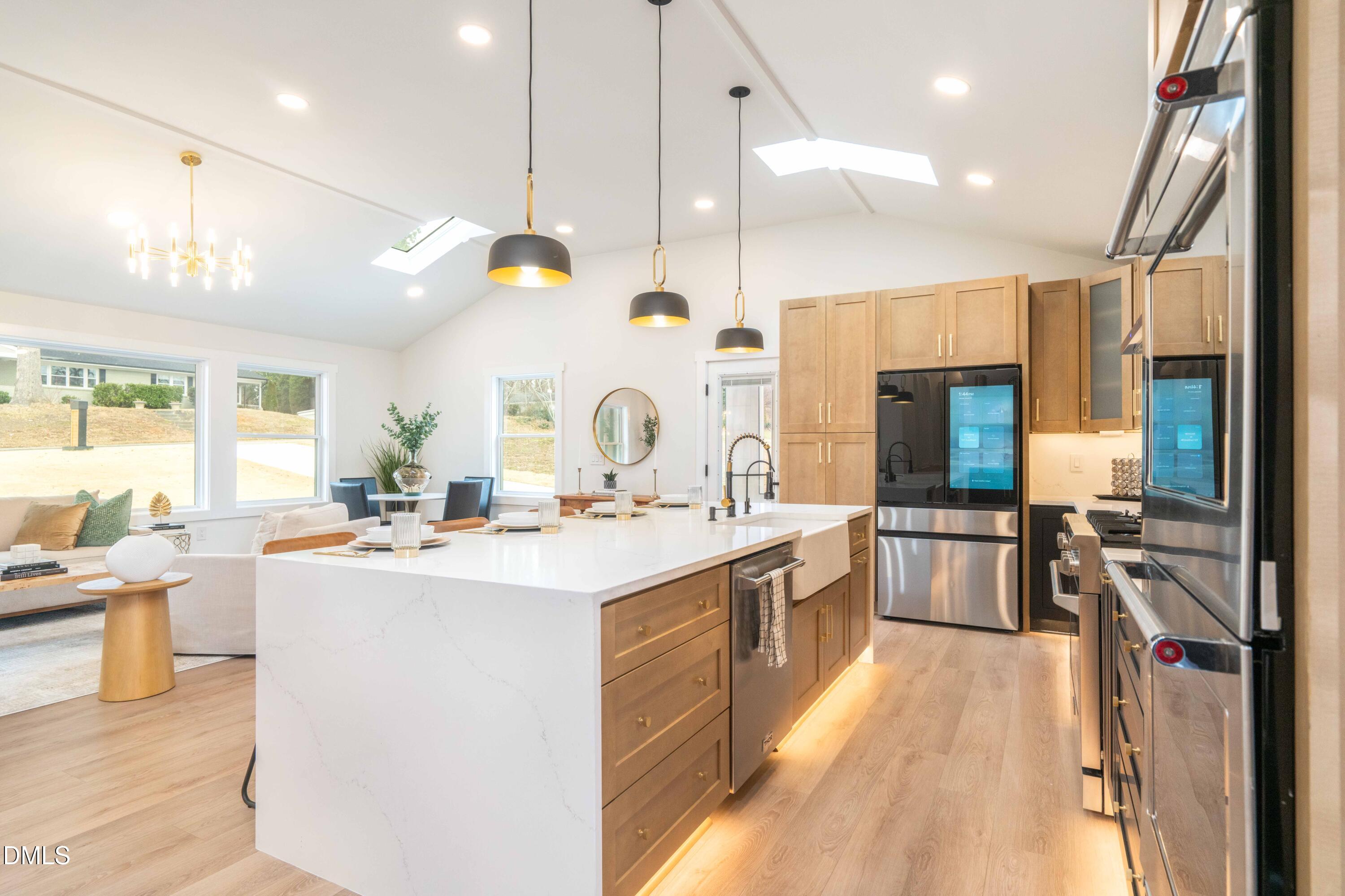 721 Currituck Drive Raleigh, NC 27609 - Photo 23 of 81 a large kitchen with a large counter top appliances and cabinets