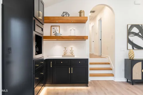 a view of walk in closet with clothes