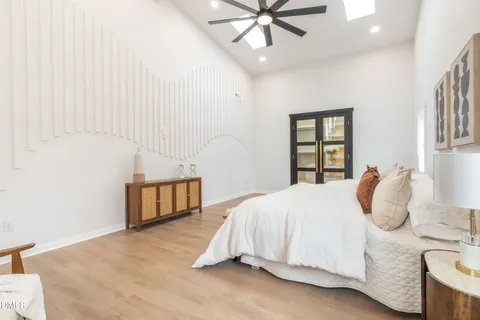 a bedroom with a bed and a lamp