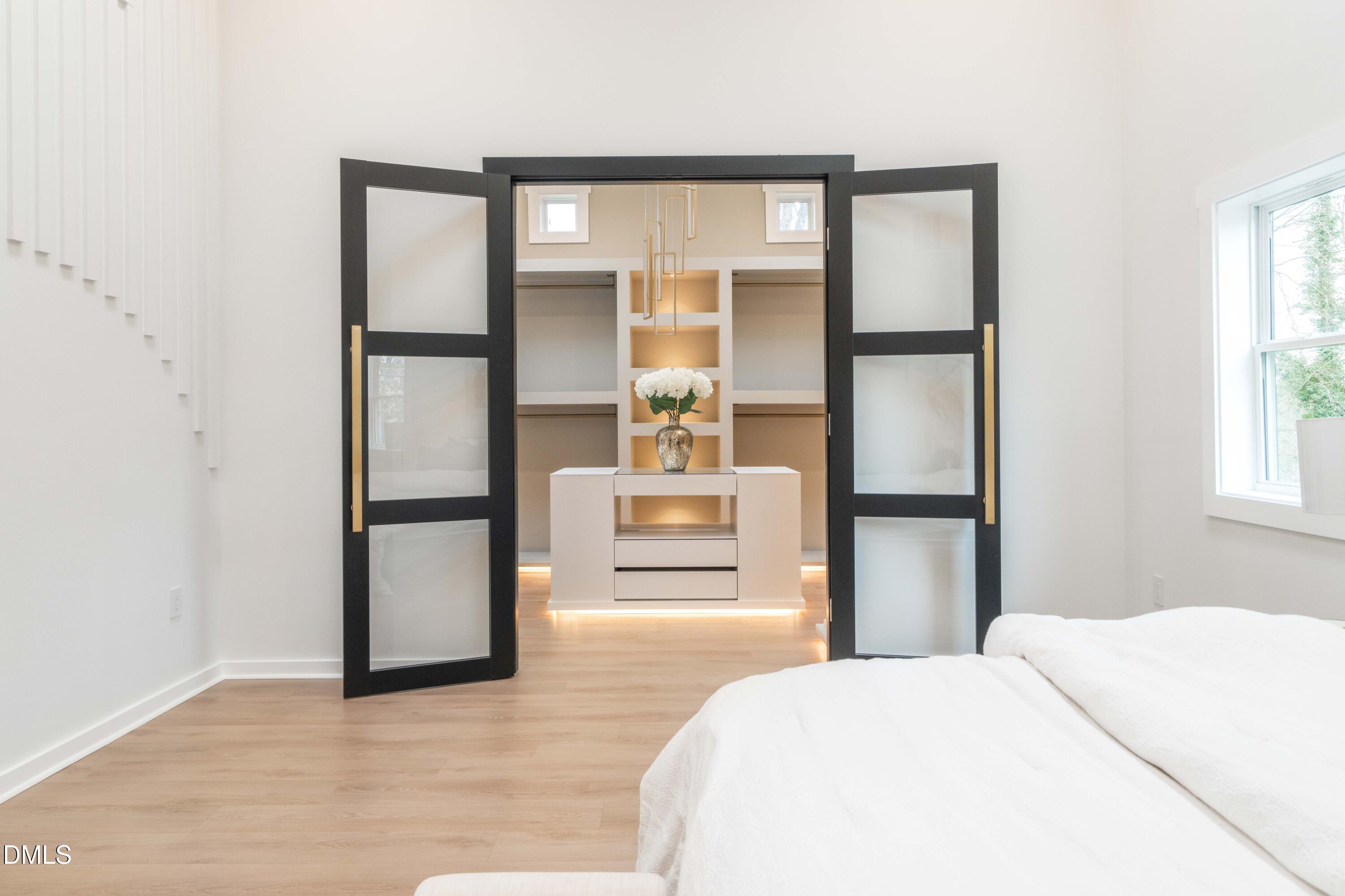 721 Currituck Drive Raleigh, NC 27609 - Photo 28 of 81 a bedroom with a bed and a large window