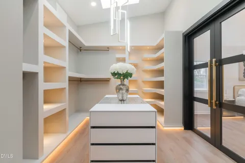 a bathroom with a sink a vanity and a shower