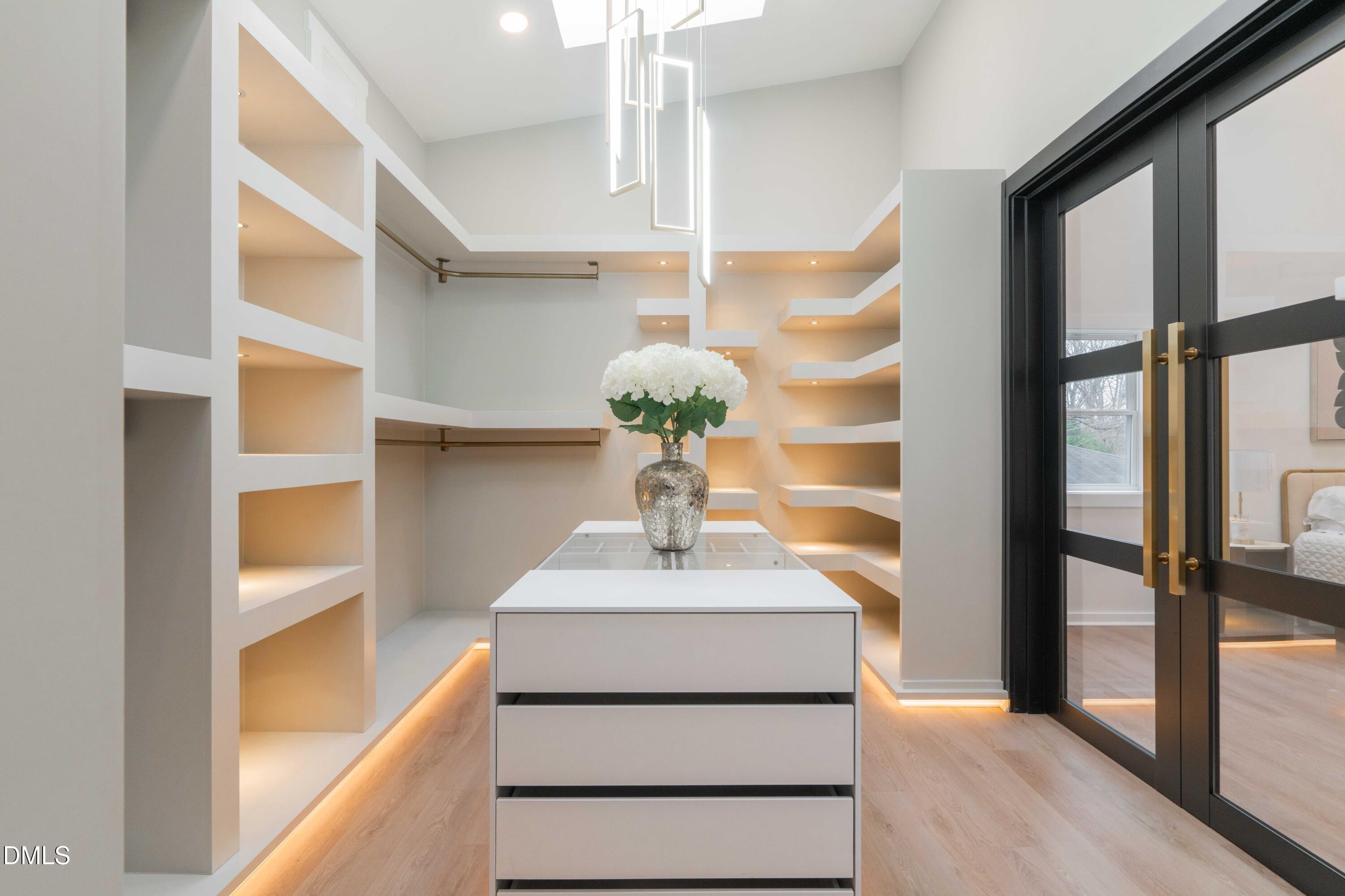 721 Currituck Drive Raleigh, NC 27609 - Photo 31 of 81 a bathroom with a sink and a mirror