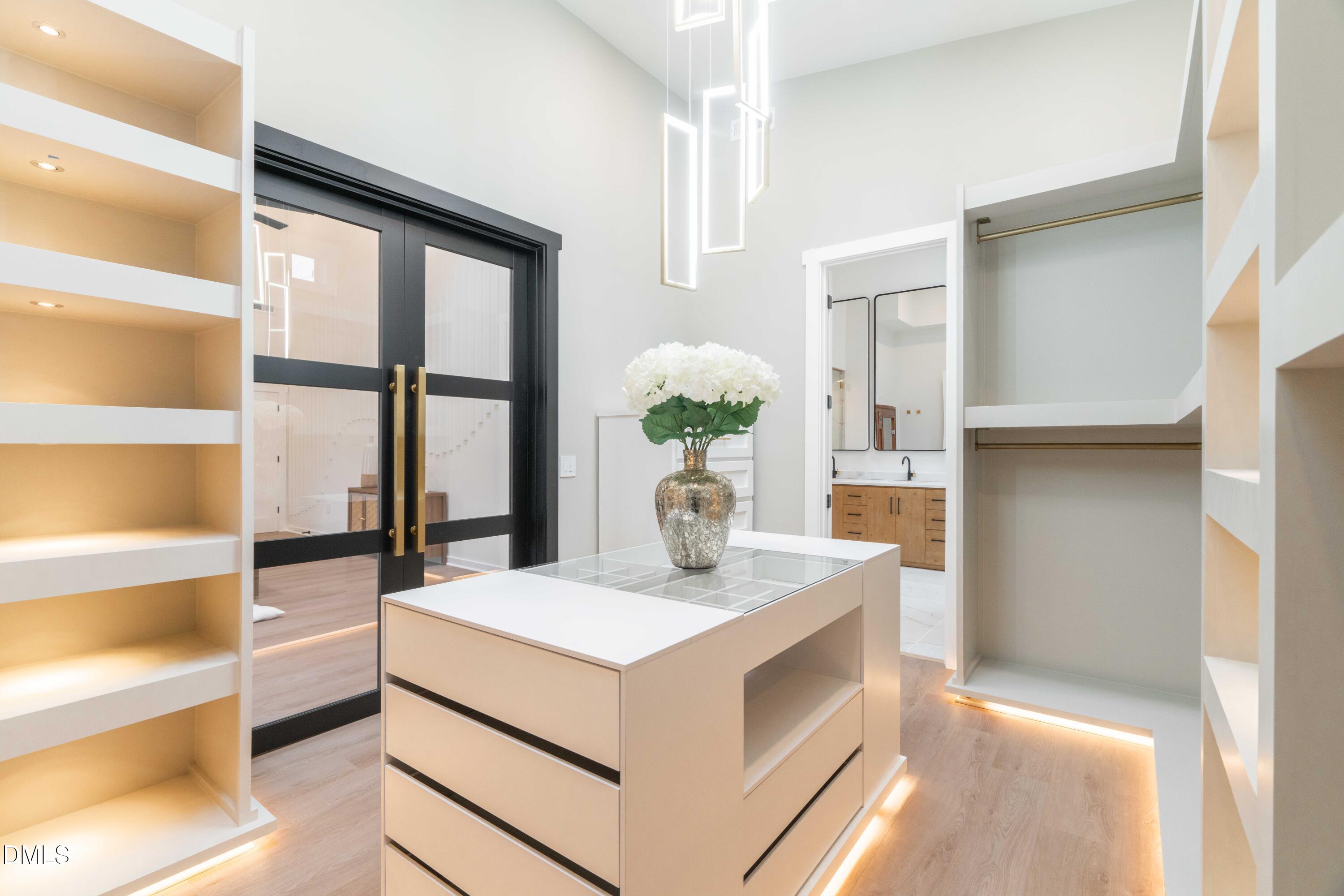 721 Currituck Drive Raleigh, NC 27609 - Photo 33 of 81 a room with kitchen island and a large window