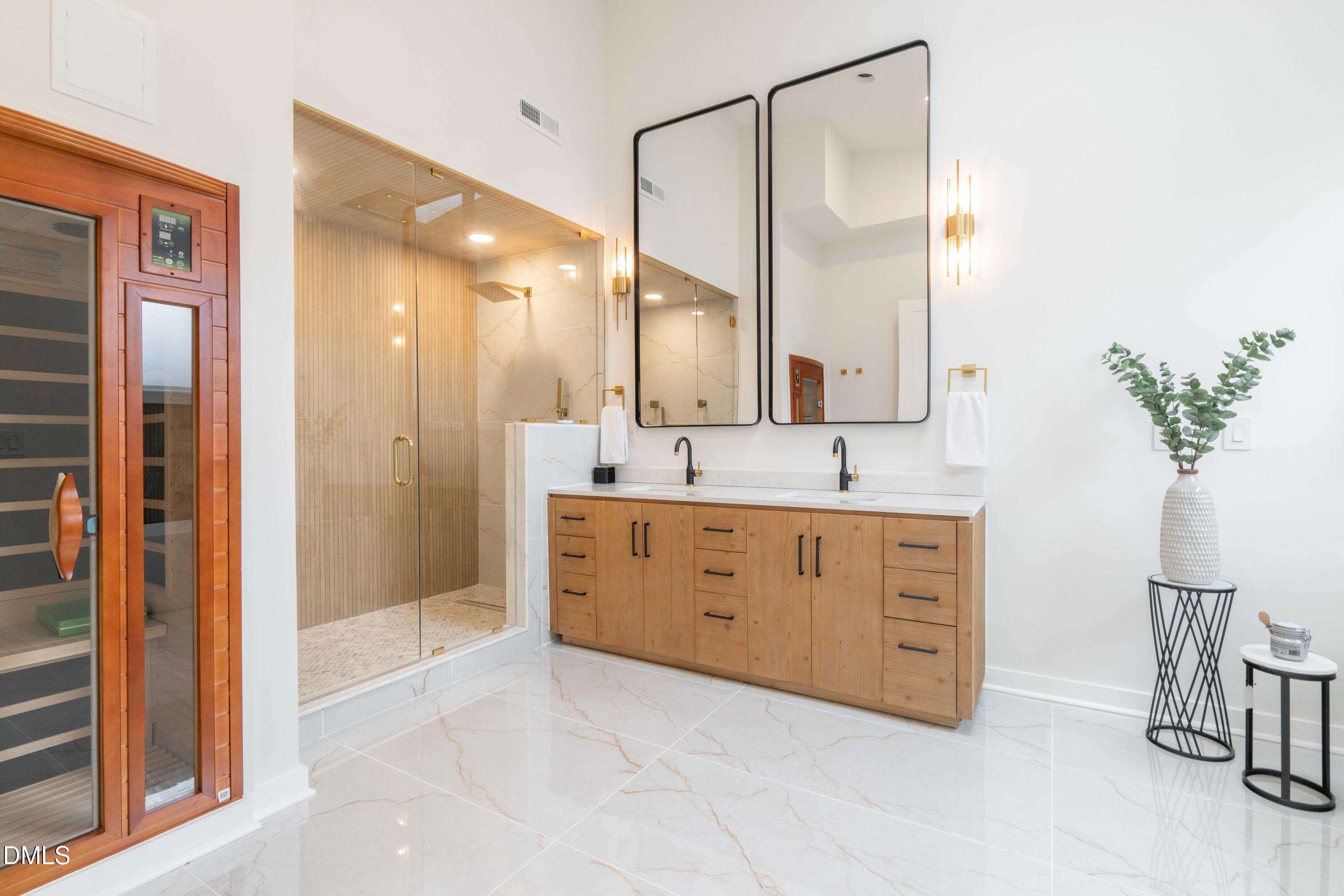721 Currituck Drive Raleigh, NC 27609 - Photo 34 of 81 a spacious bathroom with a granite countertop sink a mirror and a shower