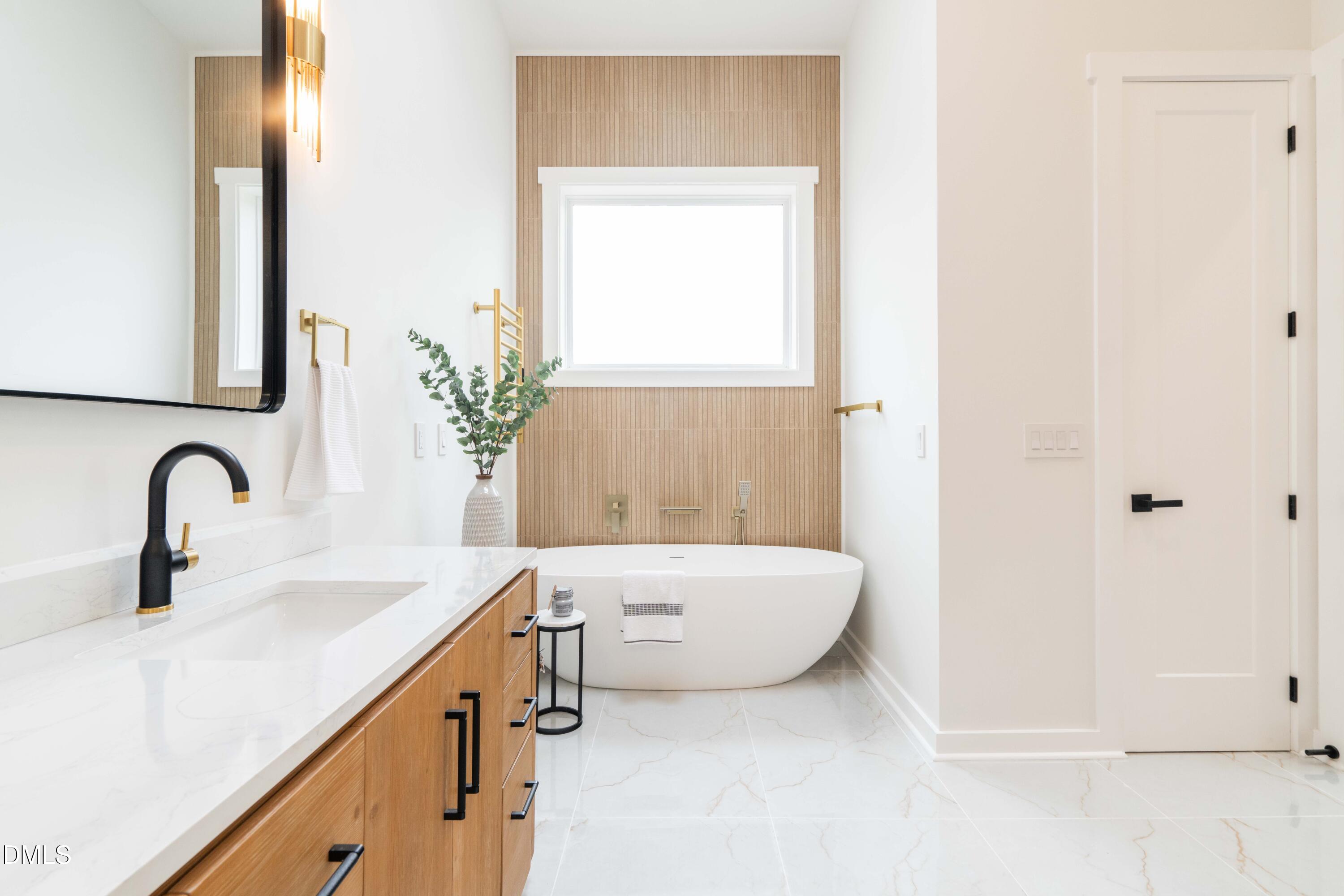 721 Currituck Drive Raleigh, NC 27609 - Photo 38 of 81 a bathroom with a sink and a mirror