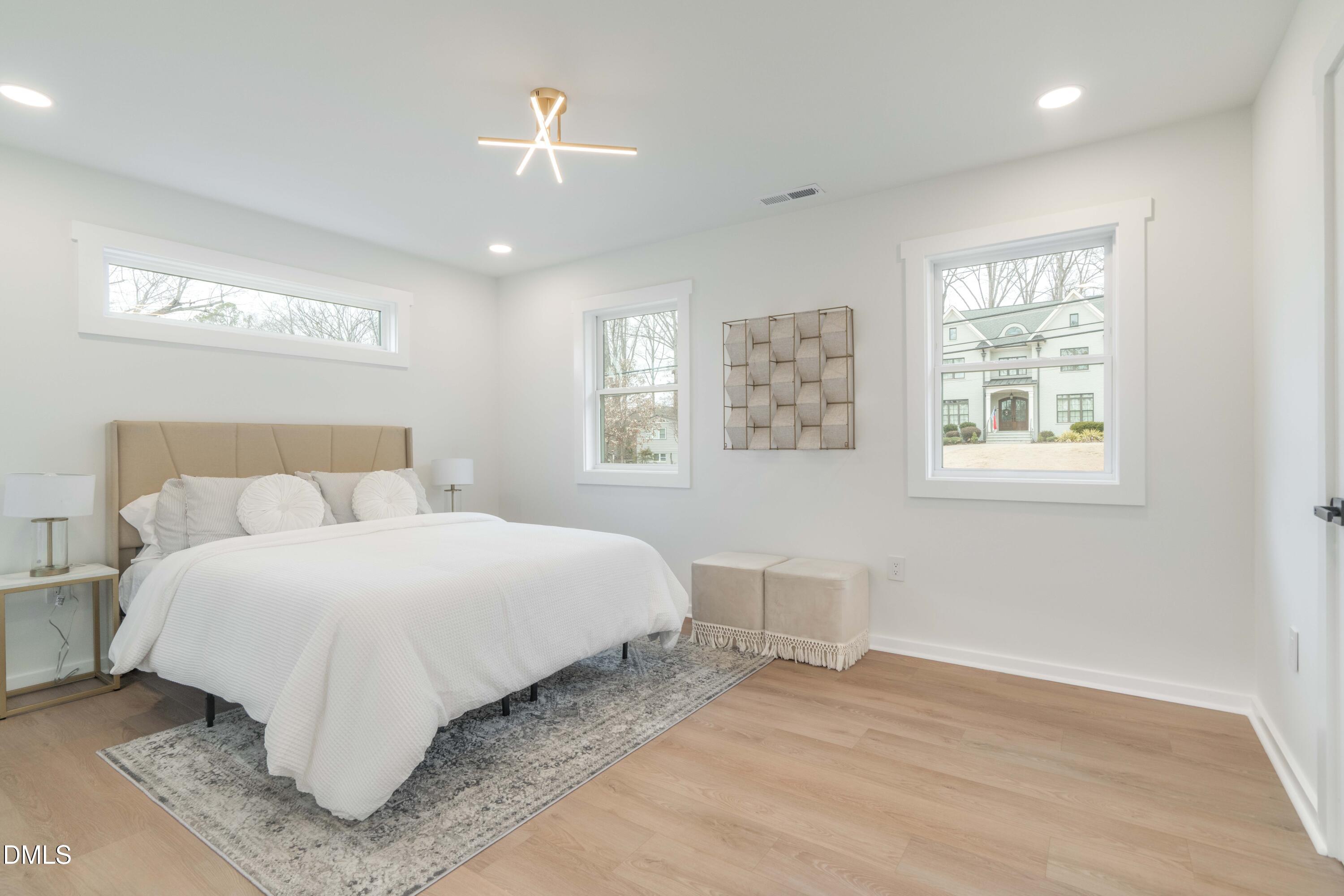 721 Currituck Drive Raleigh, NC 27609 - Photo 41 of 81 a spacious bedroom with a bed and a window