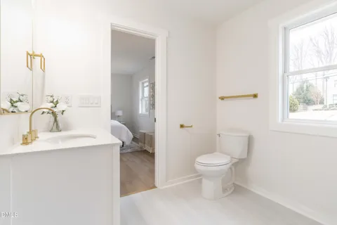 an aerial view of a house with swimming pool and garden