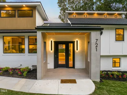 a kitchen with stainless steel appliances a sink a stove a refrigerator and cabinets