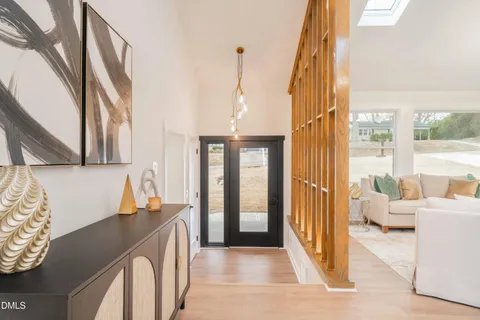 a view of a dining room with furniture and a large window