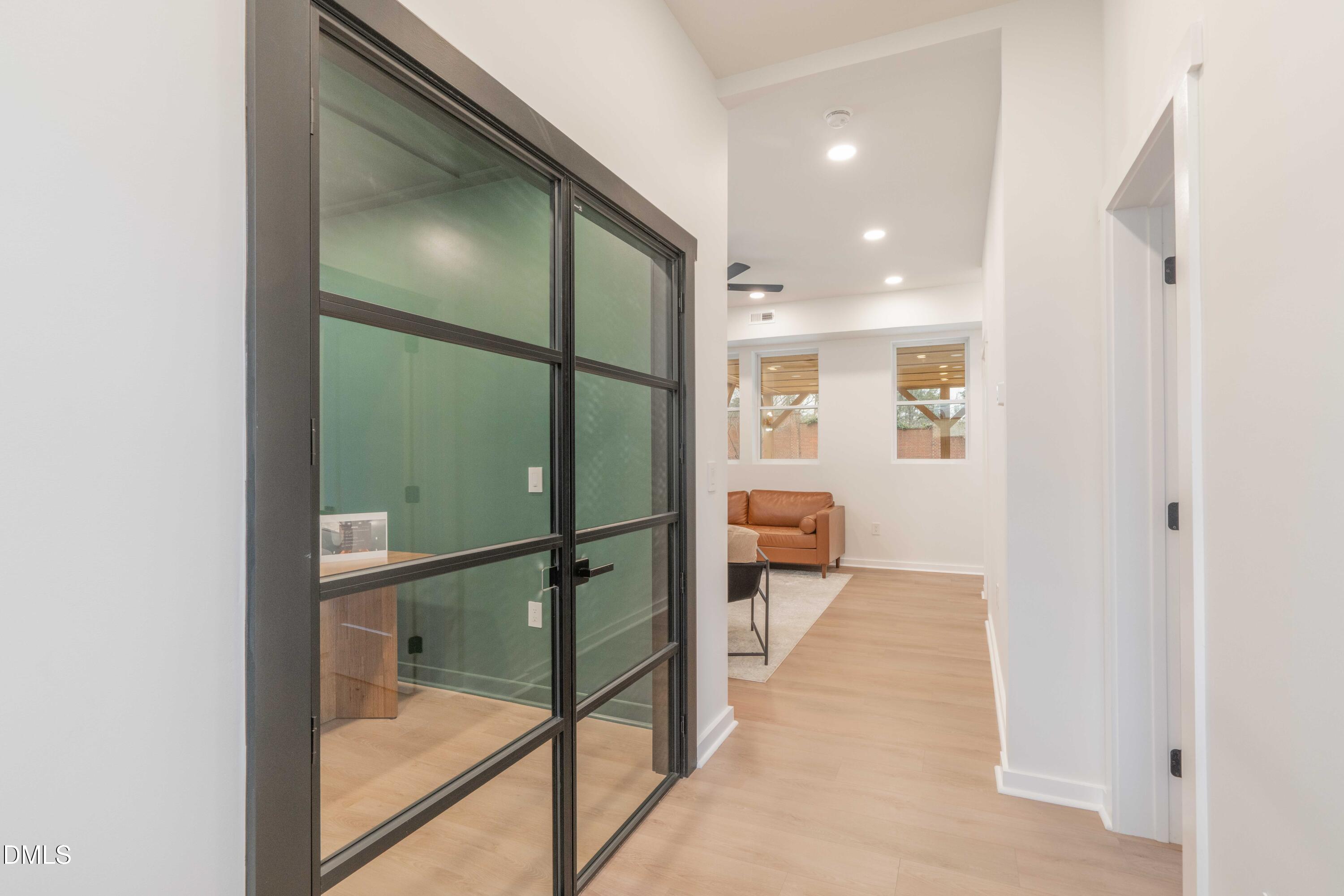 721 Currituck Drive Raleigh, NC 27609 - Photo 61 of 81 a bathroom with a glass shower door and a glass door