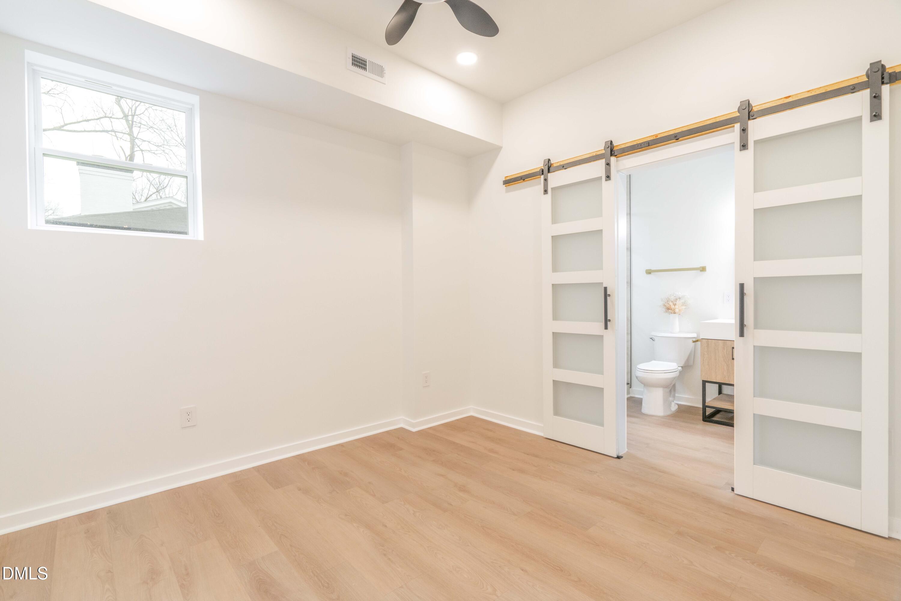 721 Currituck Drive Raleigh, NC 27609 - Photo 68 of 81 a view of an empty room with a window and closet